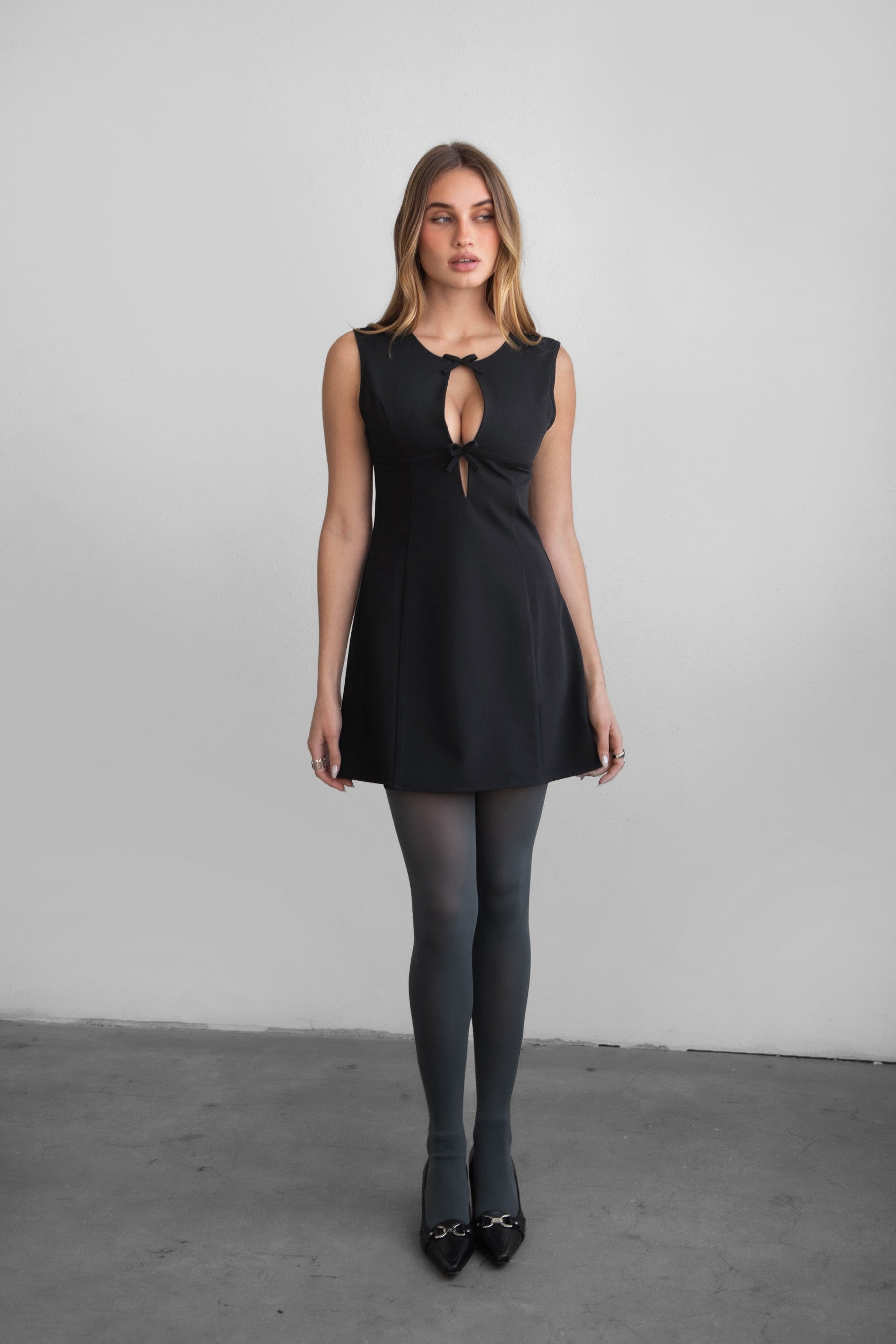 TIC TOC DA31131 BRILYN Black Wool Dobby Mini Dress with scoop neck, bow bust details, and A-line skirt.