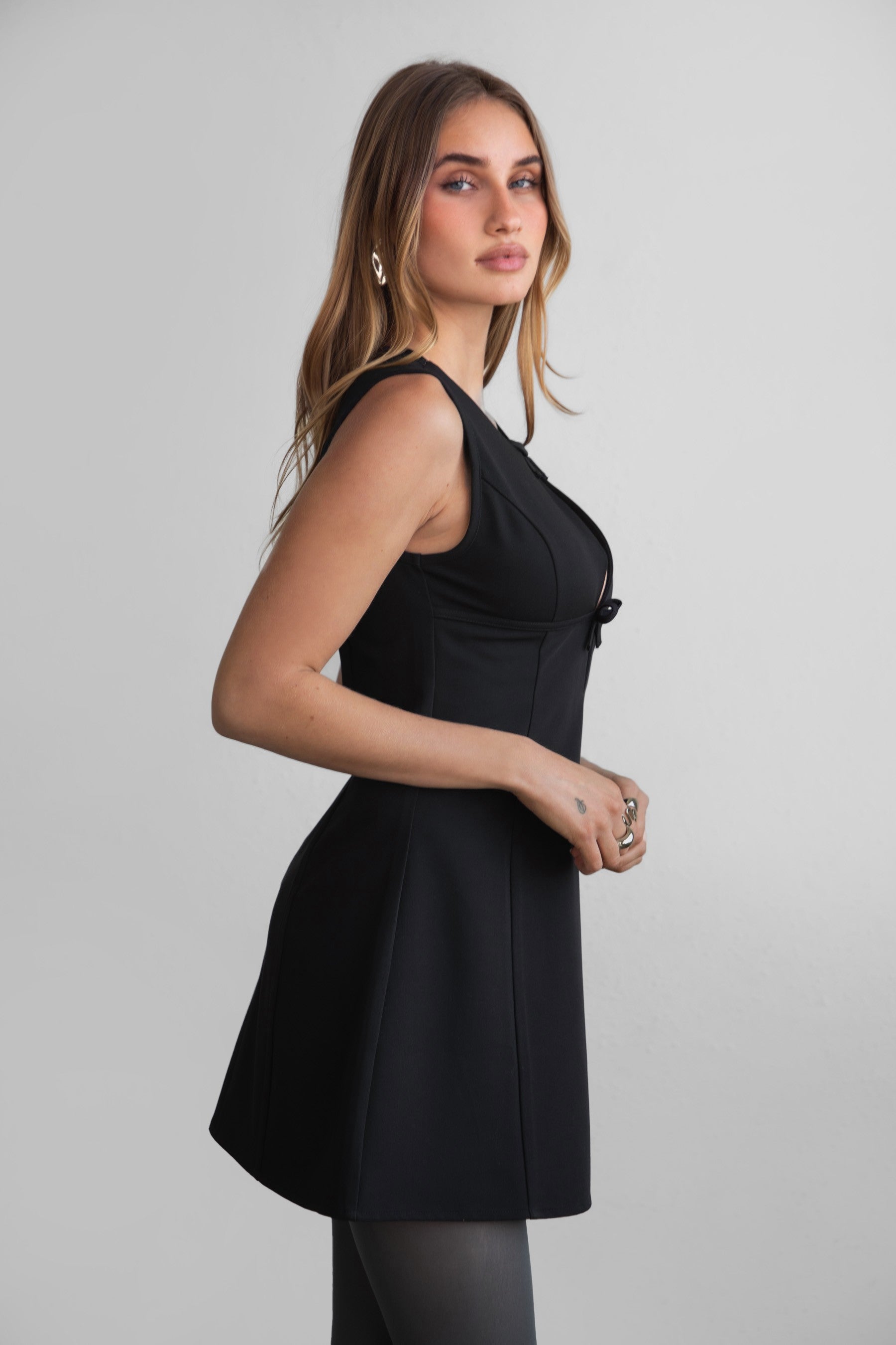 TIC TOC DA31131 BRILYN Black Wool Dobby Mini Dress with scoop neck, bow bust details, and A-line skirt.