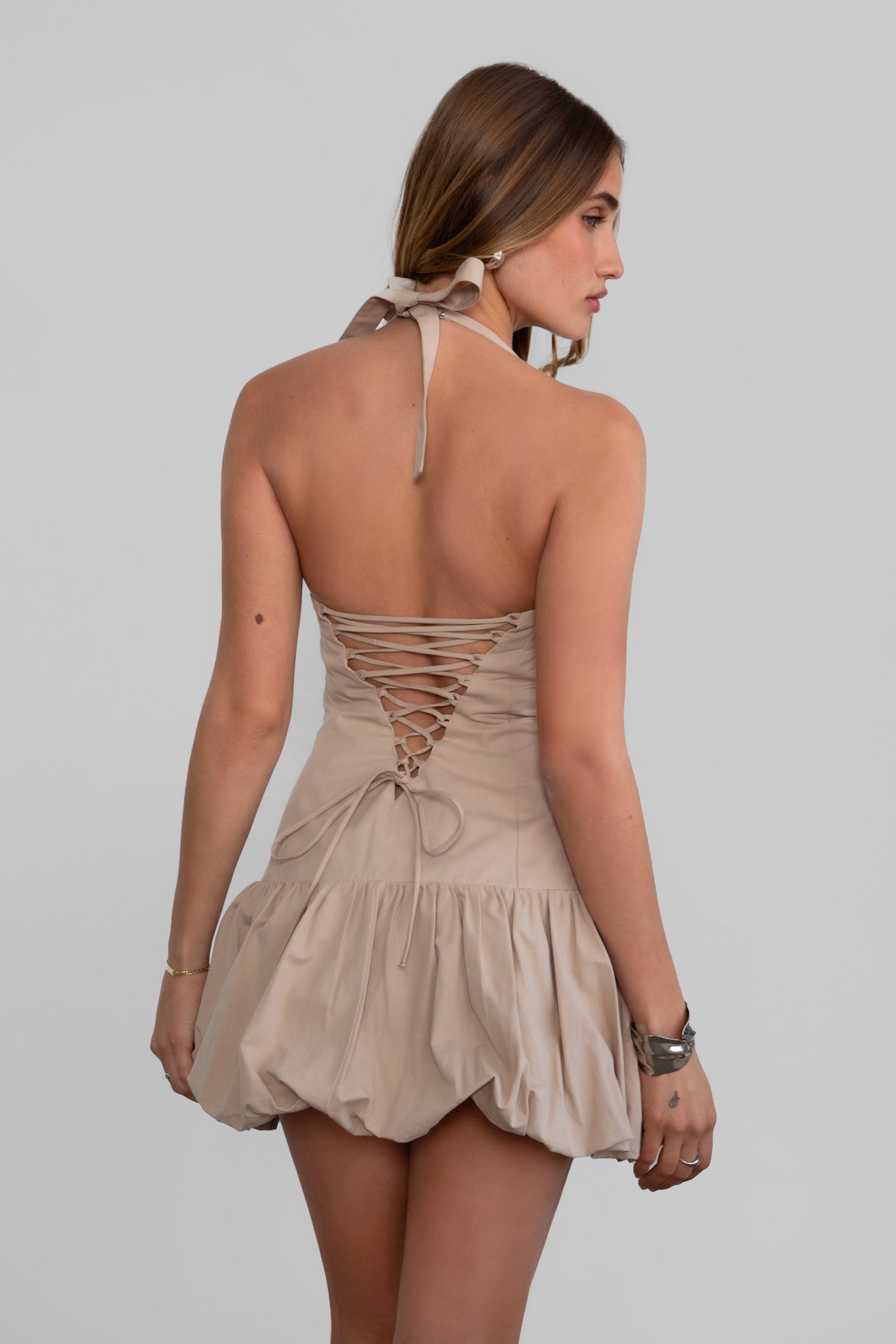 TIC TOC DH30936 DOLY Mini Dress featuring halter neckline, lace-up open back, and bubble hem in stretch twill fabric.