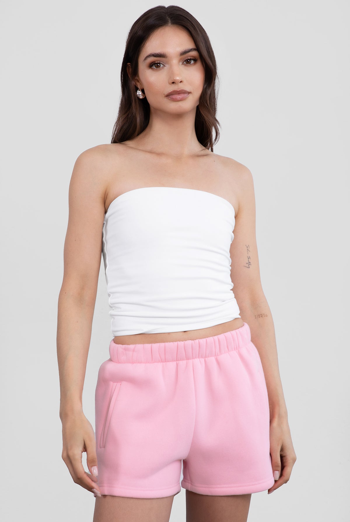 Blush pink fleece shorts featuring a relaxed straight-leg fit and smooth texture from Tic Toc.