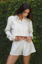 PA31288-ROWAN Linen Low Rise Drawstring Shorts are an easy essential for sun-soaked days. Designed with a relaxed fit and adjustable drawstring waist, these lightweight shorts are crafted from a breathable linen blend in a slightly unique shade from the rest of the collection. Perfect for lounging, summer getaways, or as a chic beach cover-up. Pair it with the matching top (sold separately, style TH29605) for a full boho-inspired look.