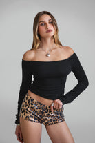 TIC TOC PH30980 CHEETAH Leopard Print Sequin Micro Shorts. Low-rise festival shorts with shimmering leopard print sequins and hidden side zipper.