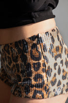 TIC TOC PH30980 CHEETAH Leopard Print Sequin Micro Shorts. Low-rise festival shorts with shimmering leopard print sequins and hidden side zipper.