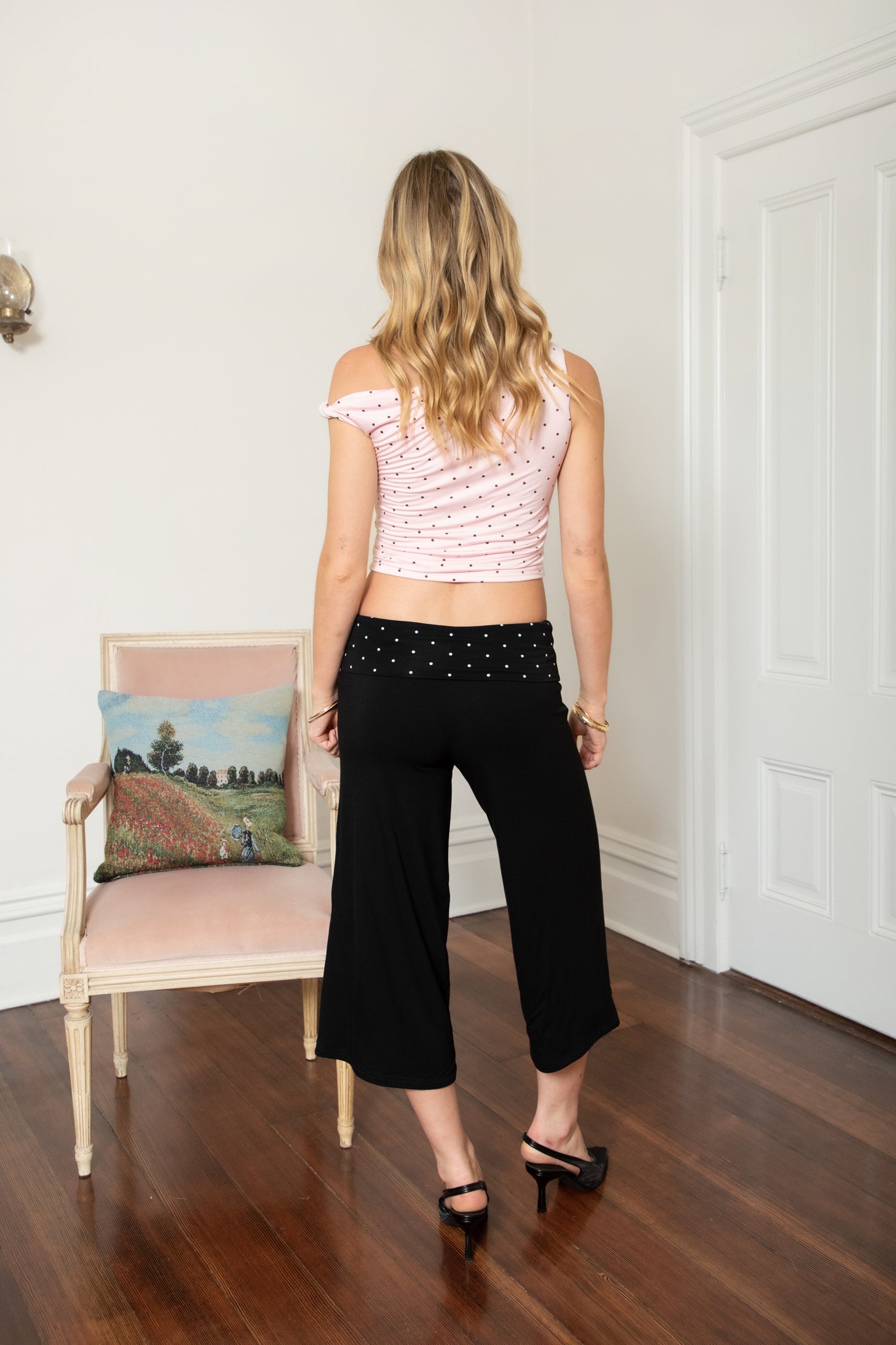 Woman wearing TIC TOC PH31998 SORA rayon fold over waist wide capri leggings featuring a soft lightweight stretch fabric, fold-over waistband with polka dot contrast detail, easy pull-on fit, and relaxed wide leg capri silhouette for a clean lounge and active-inspired everyday look.