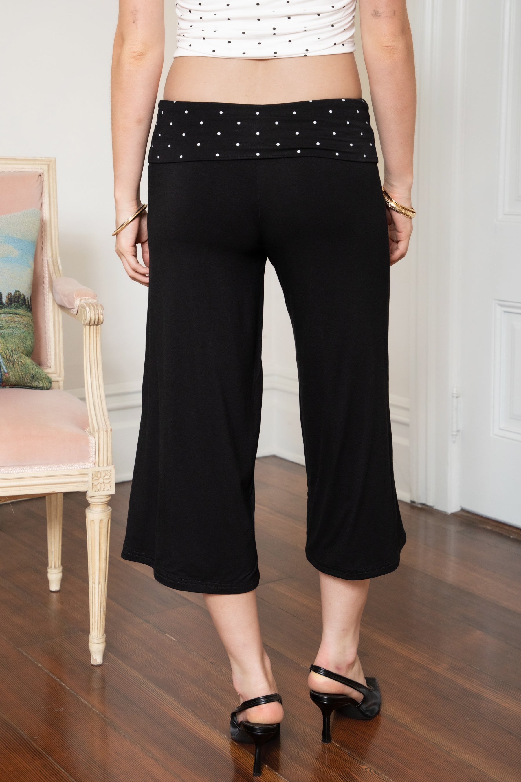 Woman wearing TIC TOC PH31998 SORA rayon fold over waist wide capri leggings featuring a soft lightweight stretch fabric, fold-over waistband with polka dot contrast detail, easy pull-on fit, and relaxed wide leg capri silhouette for a clean lounge and active-inspired everyday look.