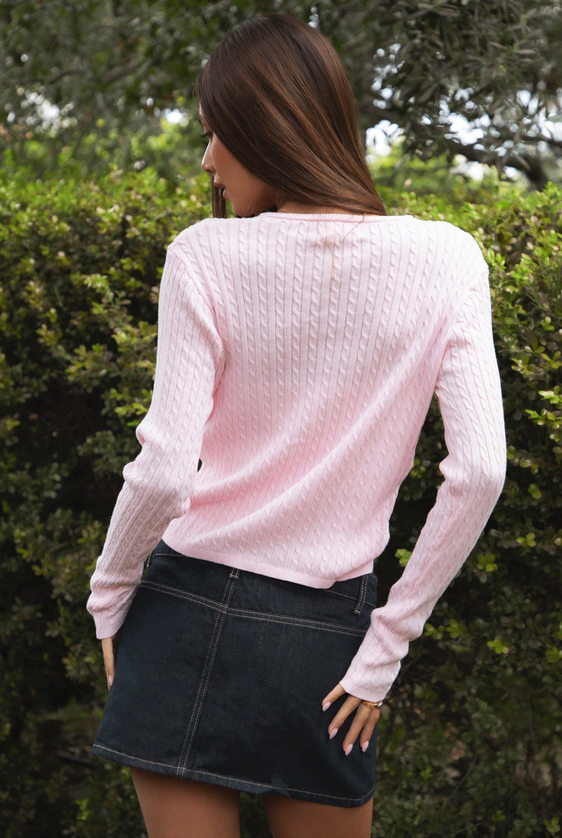 Woman wearing TIC TOC TC32069 KRISTY cable knit basic long sleeve cardigan top featuring a soft lightweight cotton cable knit texture, round neckline, full front button closure, slim fit silhouette, and semi-cropped length for a polished preppy everyday look.