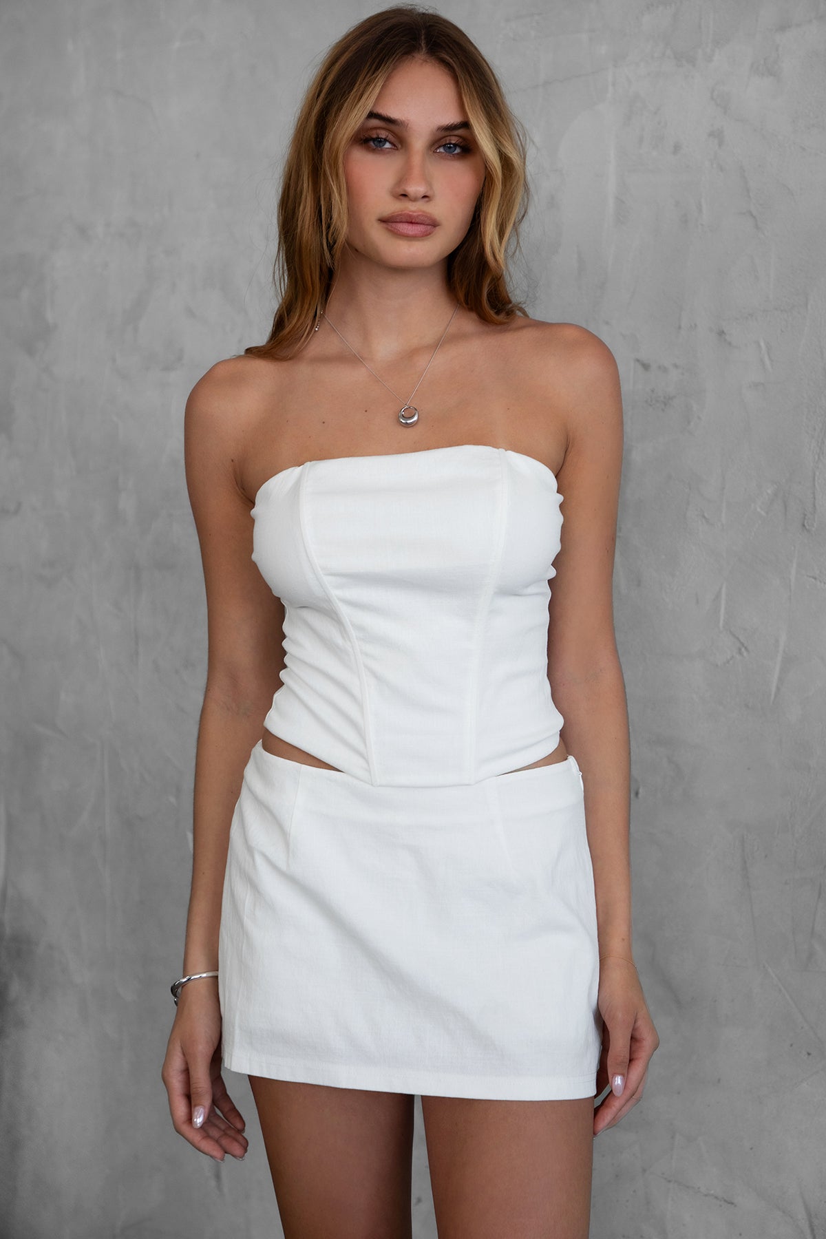 TIC TOC TH30024 JANICE Stretch Linen Corset Top in white features boned panel construction, double-lined fabric, and an exposed back zipper.