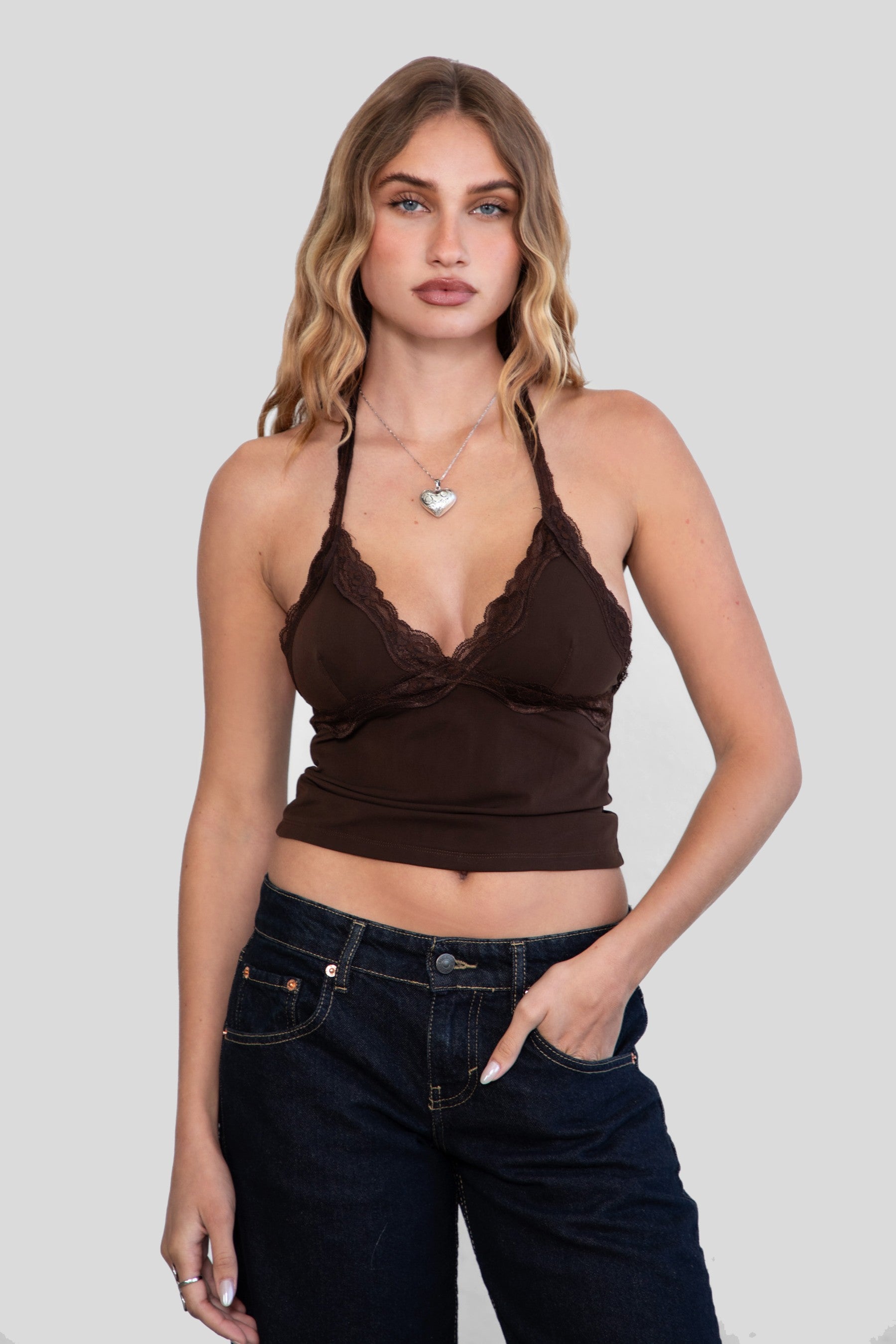 MILLIE Mesh Lace Halter Neck Top 
Fixed Halter Neckline 
Lace Trim Detail 
Double Lined Stretch Mesh Fabric 
90% POLYESTER 10% SPANDEX