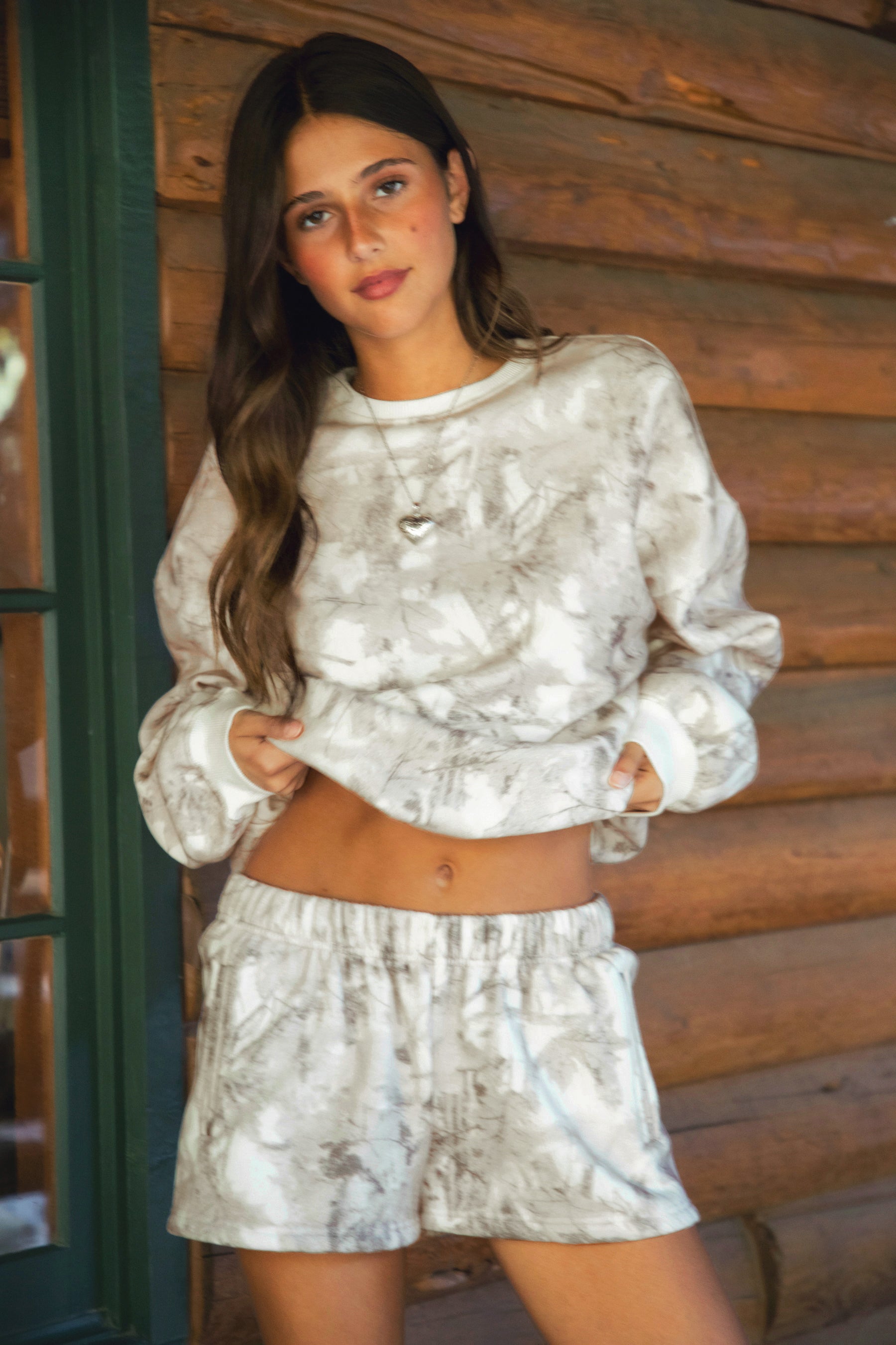 AVERY Light Woodland Camo Mid Rise Fleece Shorts 
Relaxed Straight Leg Lounge Fit
Elasticated Waistband 
Deep Reversible Side Pockets 
Light Forest Woodland Camo in Dusted Grey
Featured In Our New Cloud Fleece Fabric 
Back To School Western Rodeo Outfit Fashion Inspo
Cloud Fleece Key Features: 
Soft & Lightweight: Gentle on the skin with a breezy feel.
Midweight Warmth: Keeps you comfortable without overheating.
Drapey Design: Flows effortlessly for a flattering, laid-back look