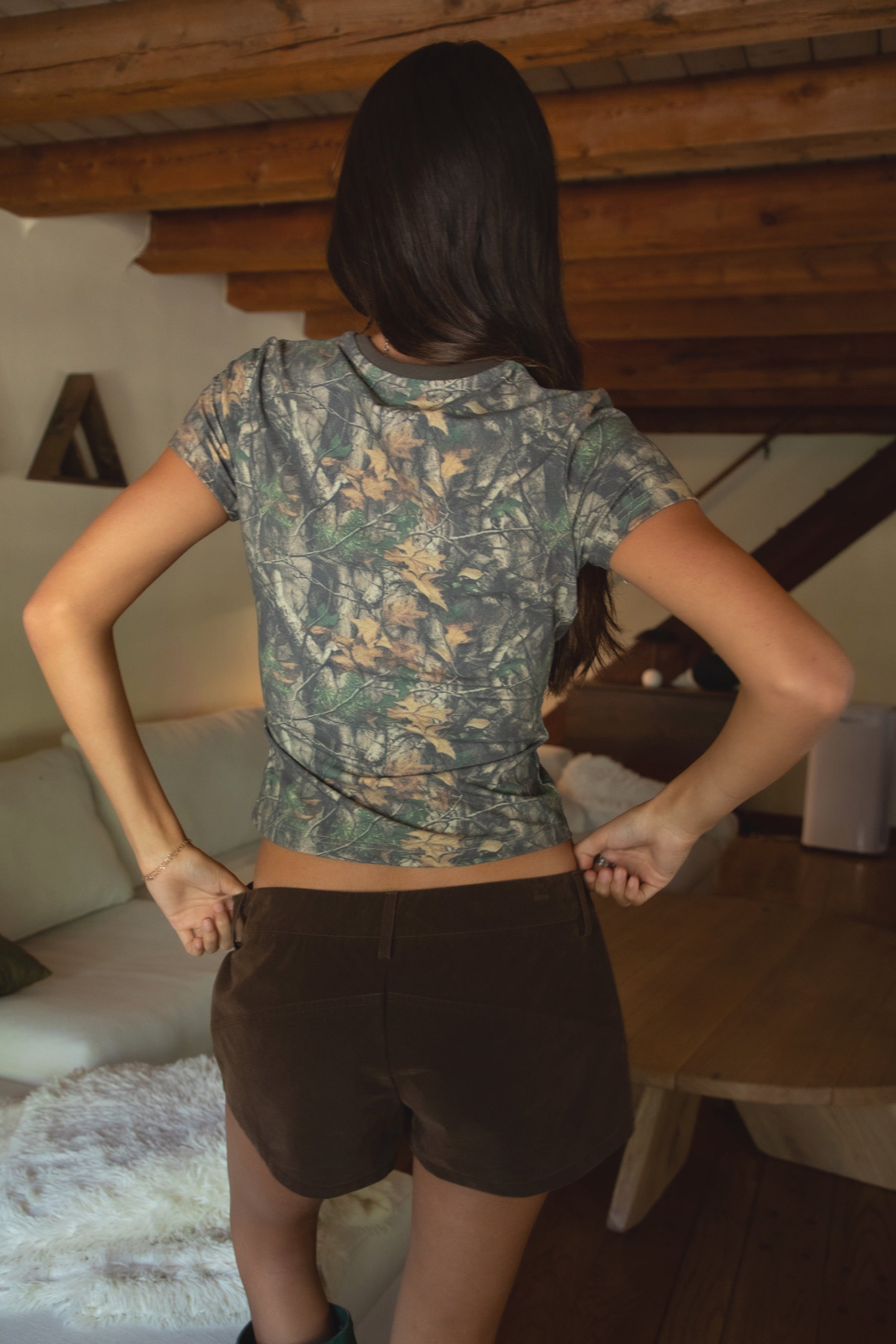 NOLA Woodland Camo Jersey Baby Tee 
Contrast High Round Neckline Short Sleeve Top 
Short Cap Sleeves
Smooth Bodyhugging Stretch Fabric
Elevated Lounge Basic Top To Match Fleece Collection
Forest Woodland Camo
Back To School Western Rodeo Outfit Fashion Inspo