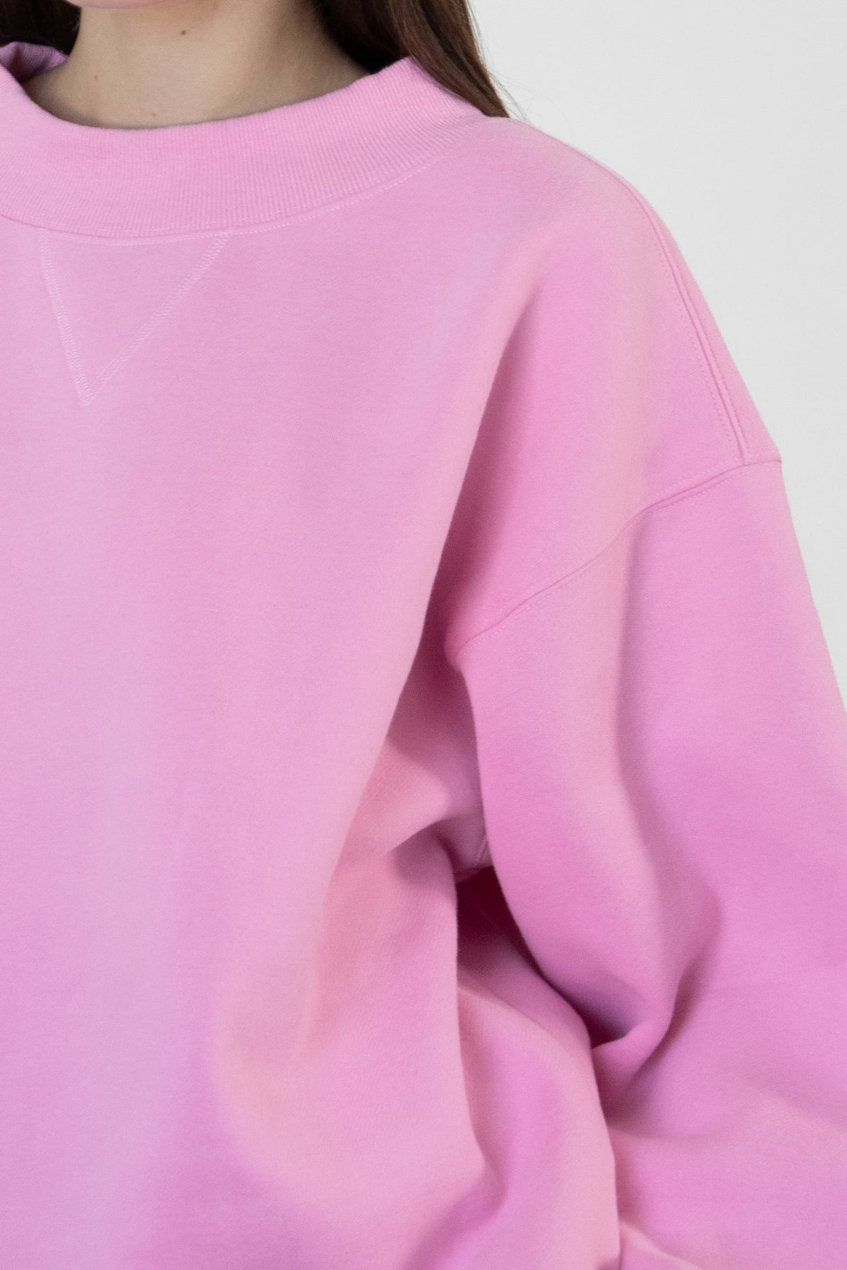 Woman wearing LANI mock neck cloud fleece sweatshirt featuring soft cotton blend cloud fleece fabric, ribbed mock neckline, relaxed oversized fit, dropped shoulder design, long sleeves with ribbed cuffs, triangle stitch detail at center front, and ribbed hem for a cozy comfortable finish.