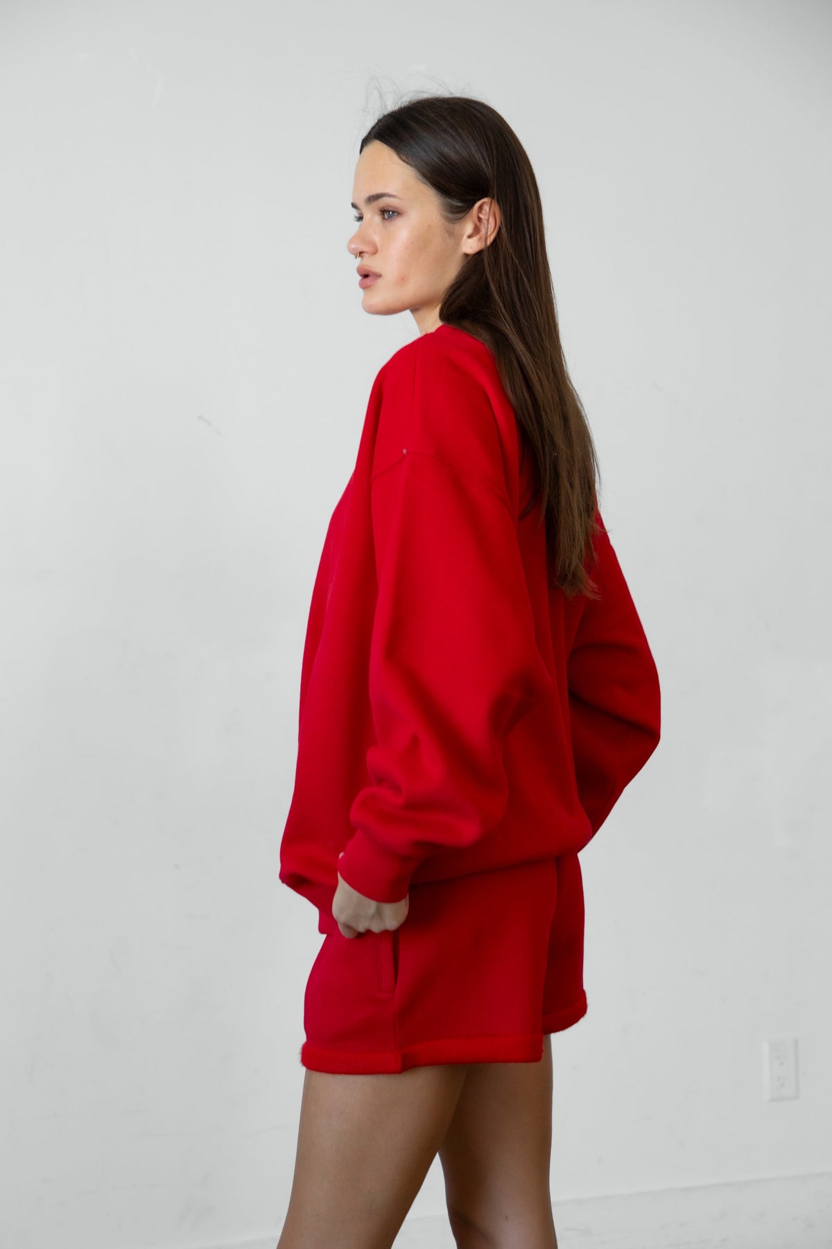 Woman wearing LANI mock neck cloud fleece sweatshirt featuring soft cotton blend cloud fleece fabric, ribbed mock neckline, relaxed oversized fit, dropped shoulder design, long sleeves with ribbed cuffs, triangle stitch detail at center front, and ribbed hem for a cozy comfortable finish.