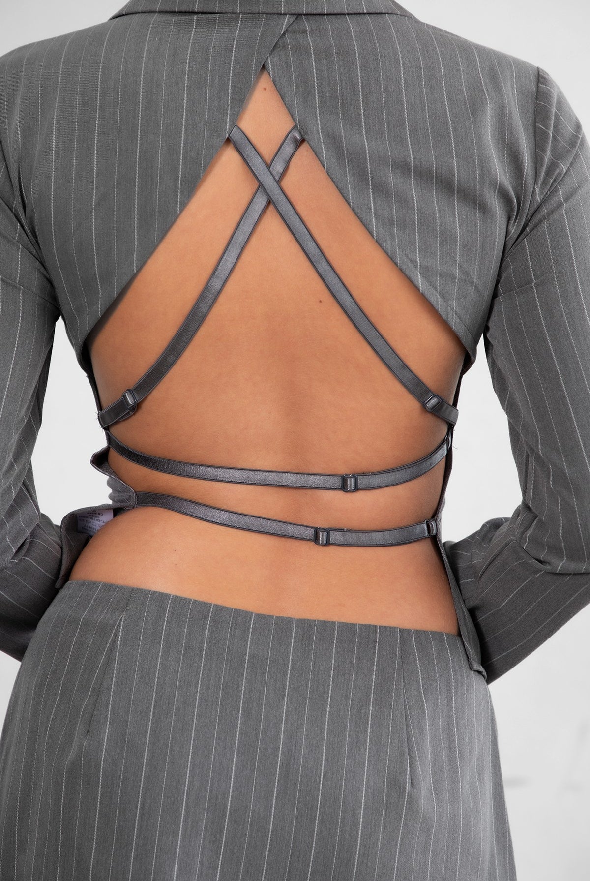 GEEK Pinstripe Mini Skirt Set
Long Sleeve Top
Low V Collared Neckline
With Connected Hook and Eye Closure
Slit Open Hem Design
Full Open Back Design
With Connected Criss Cross Adjustable Straps
Matching Low Rise Mini Skirt