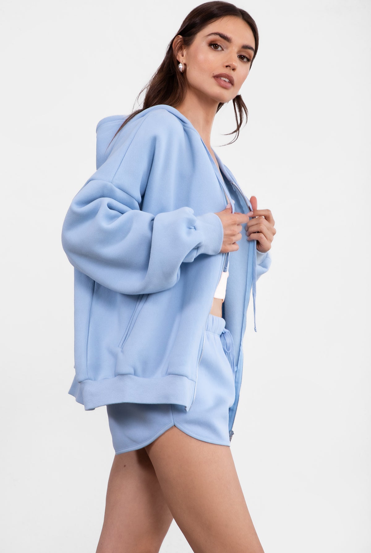 Baby blue fleece zip-up hoodie featuring a relaxed fit and dropped shoulder design from Tic Toc.