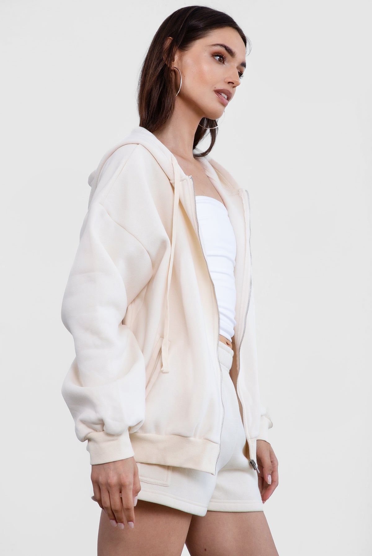 Ecru zip-up hoodie with a relaxed fit and smooth fabric for a cozy everyday style by Tic Toc.