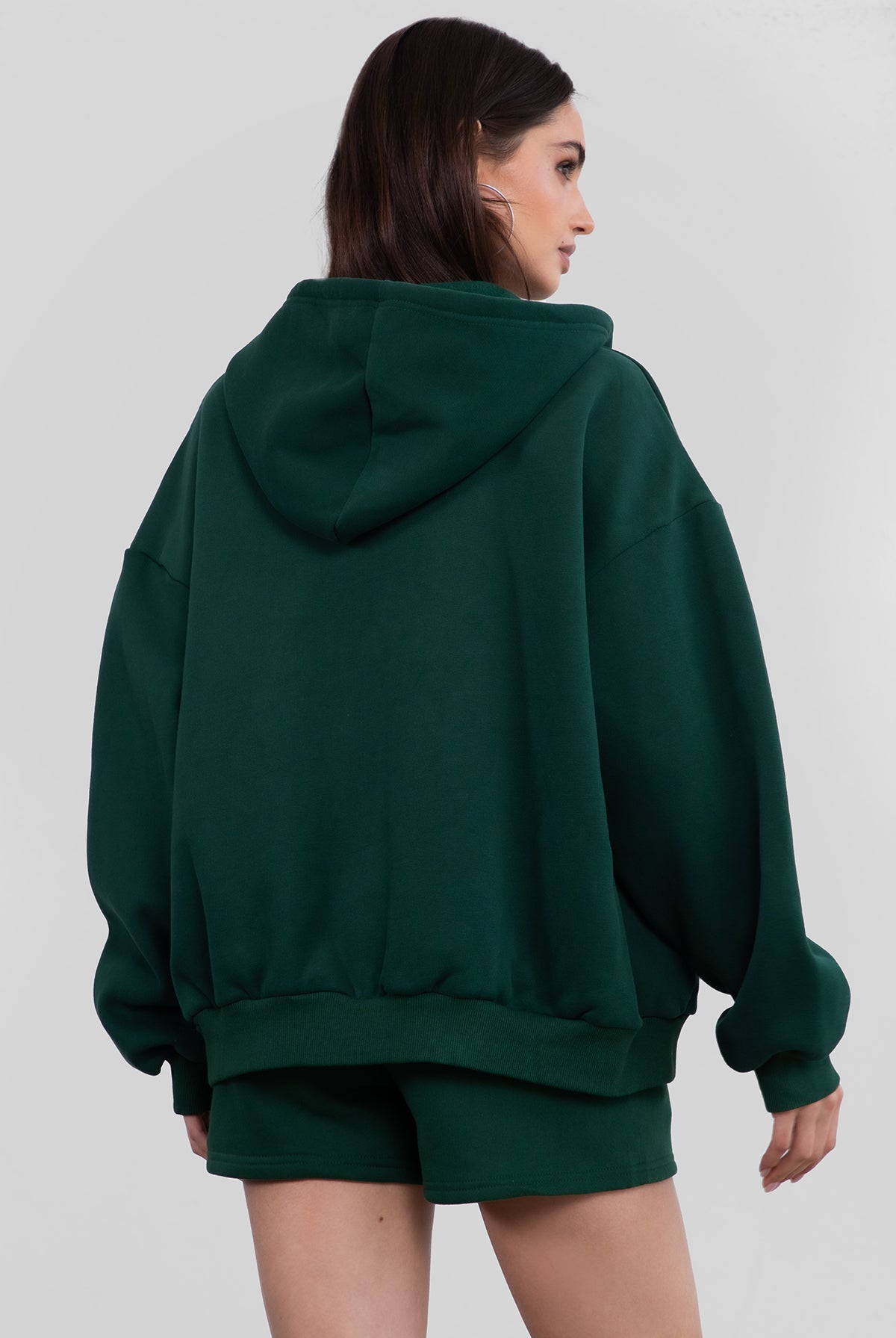 Hunter green fleece hoodie with an adjustable drawstring hood and ribbed cuffs for added comfort by Tic Toc.