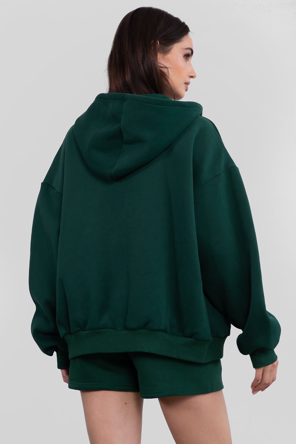 Hunter green fleece hoodie with an adjustable drawstring hood and ribbed cuffs for added comfort by Tic Toc.