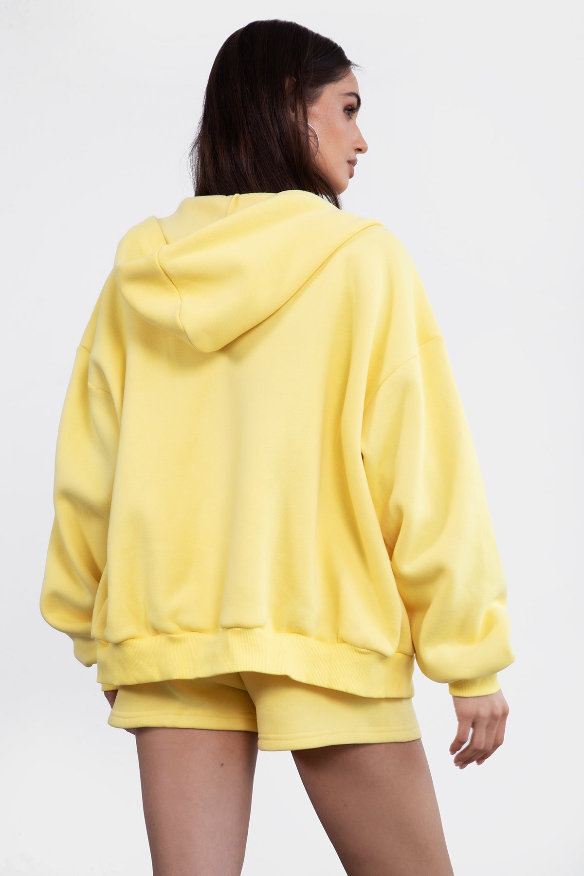 Yellow oversized zip-up fleece hoodie featuring a relaxed fit and adjustable drawstring hood by Tic Toc.