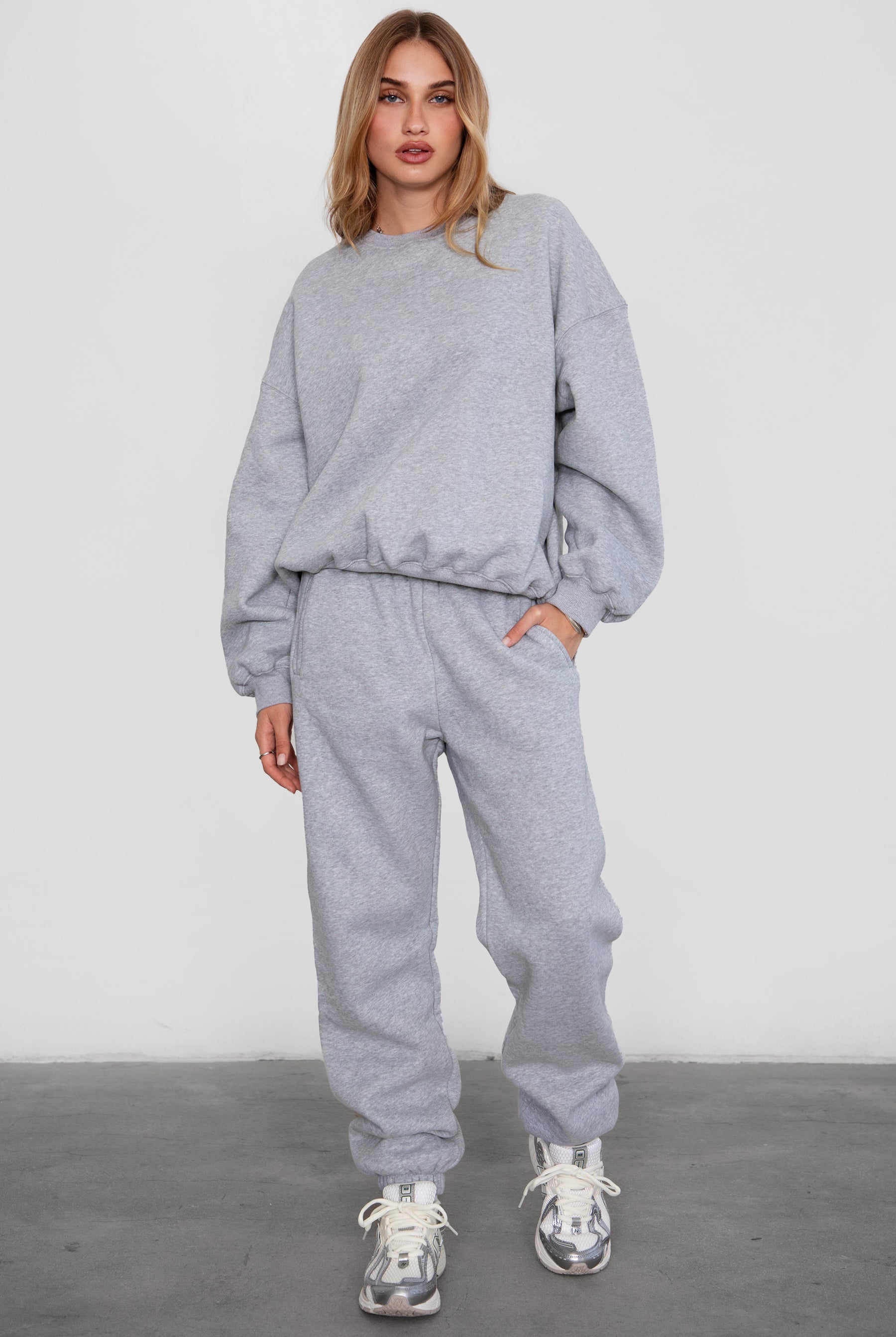 Relaxed fit fleece sweater for women with dropped shoulders and plush cozy fabric in heather grey