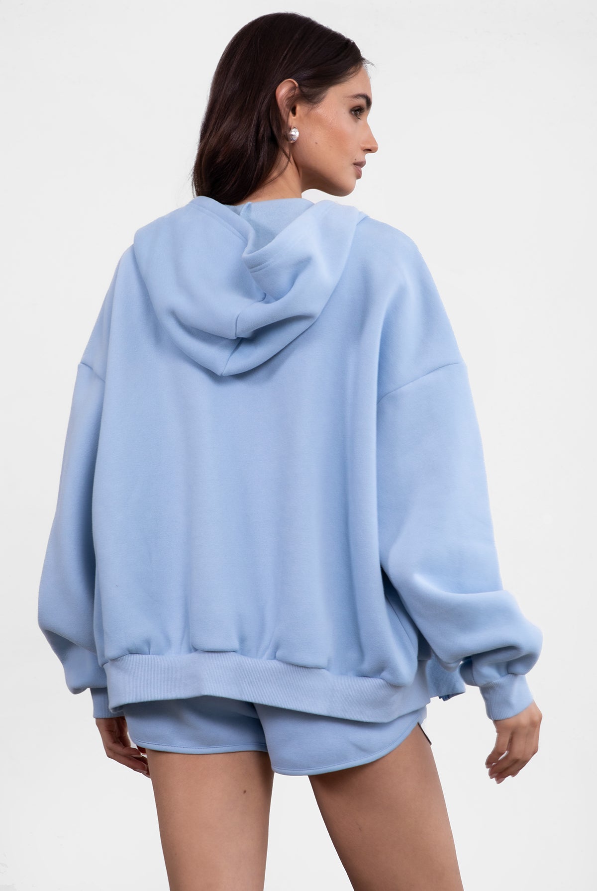 Baby blue fleece zip-up hoodie featuring a relaxed fit and dropped shoulder design from Tic Toc.