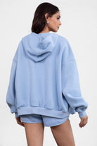 Baby blue fleece zip-up hoodie featuring a relaxed fit and dropped shoulder design from Tic Toc.