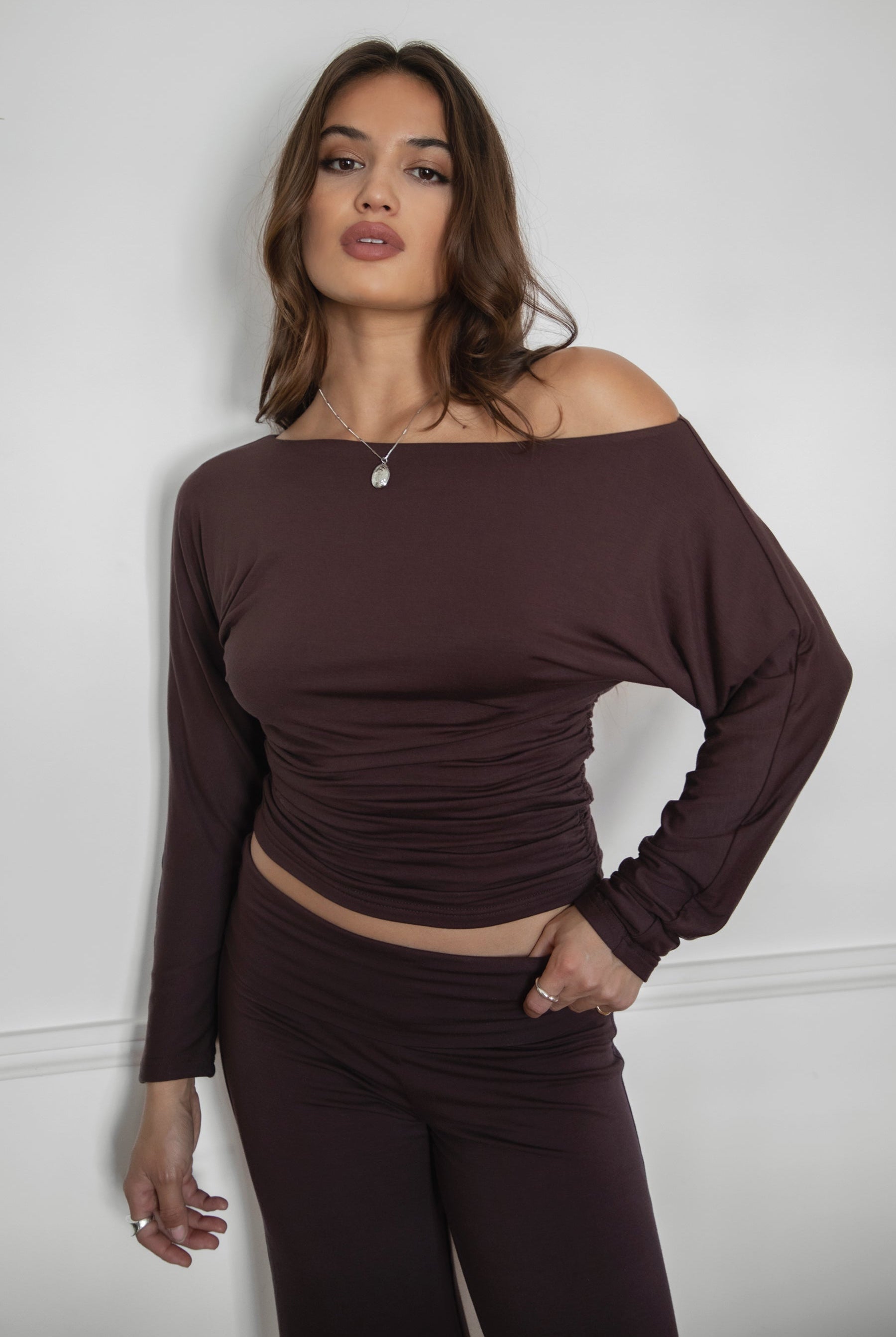 SORA Asymmetric Off-The-Shoulder Long Sleeve Top is the definition of effortless cool. Featuring a slouchy cropped fit with a wide boat neckline that can be styled on or off the shoulder, this lightweight top drapes softly through the sleeves and cinches at the waist with subtle ruching. Made in a flowy stretch fabric for all-day comfort and ease.
Pairs perfectly with matching bottoms (sold separately: PH31588BA-SORA, PH30646BA-CORA, SC31643BA-CHIA) for a sleek, minimalist streetwear set.
93% RAYON 7% SPA