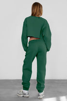 Game-day ready high-waist sweatpants in blush from the Essentials Plush Fleece Collection in hunter green