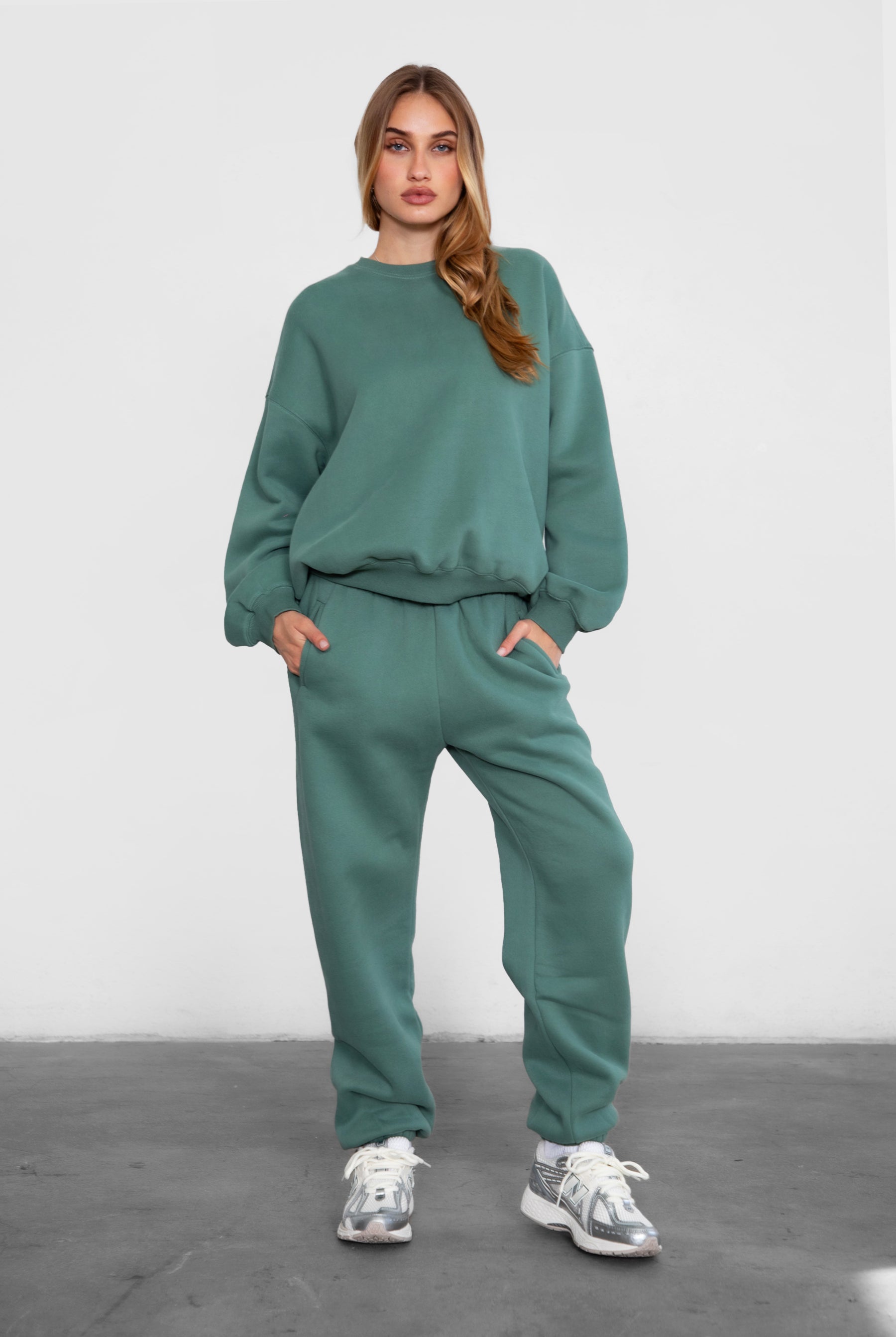 Game-day ready high-waist sweatpants in blush from the Essentials Plush Fleece Collection in pine green