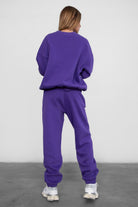 Game-day ready high-waist sweatpants in blush from the Essentials Plush Fleece Collection in purple