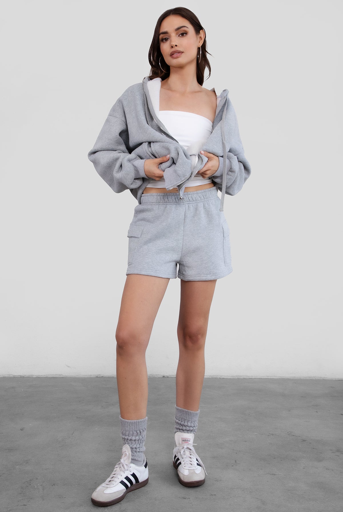 Heather grey mid-thigh fleece shorts with functional cargo pockets and a soft texture from Tic Toc.