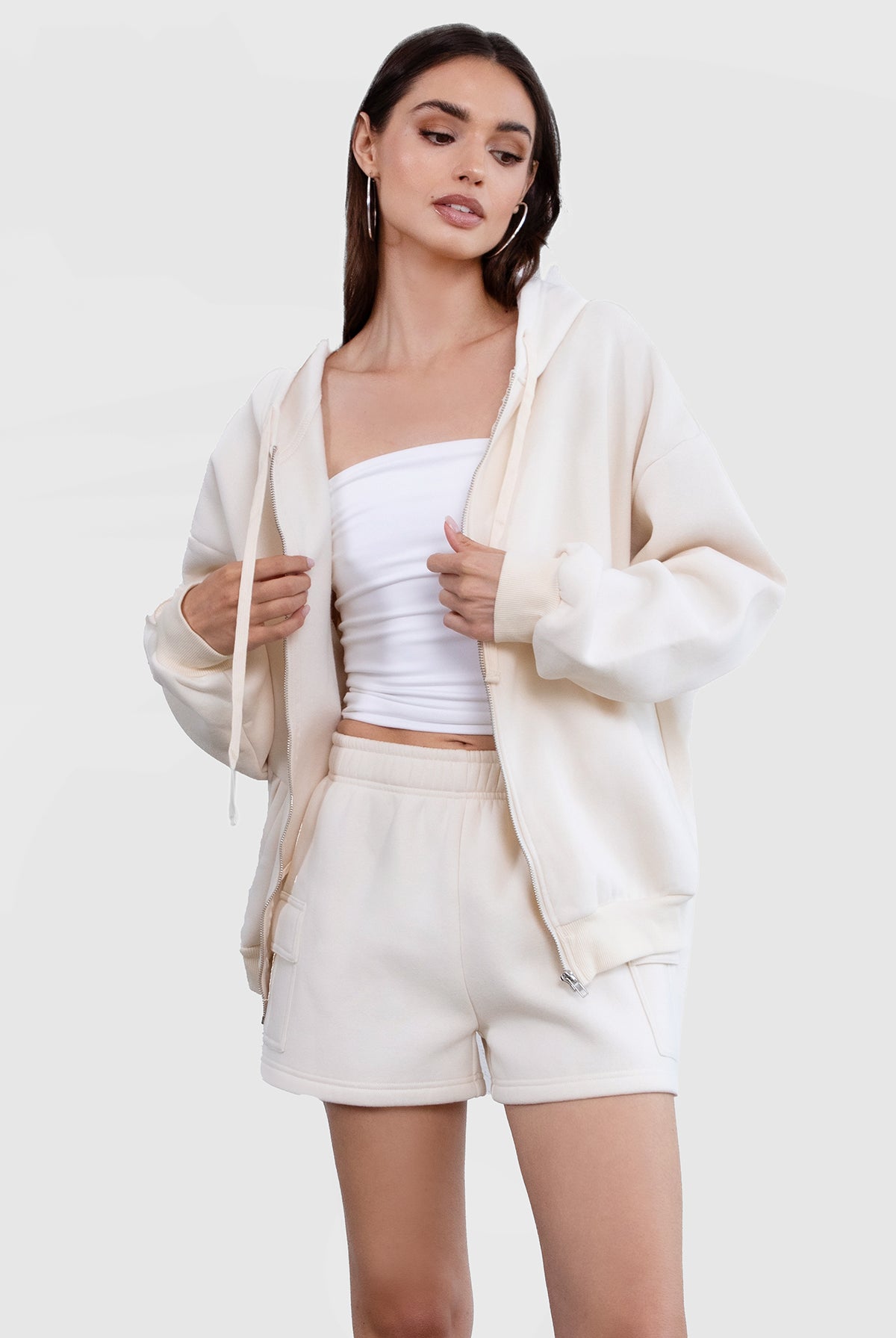 Ecru zip-up hoodie with a relaxed fit and smooth fabric for a cozy everyday style by Tic Toc.