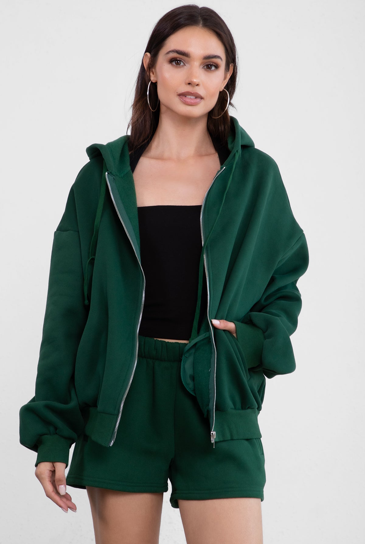 Hunter green fleece hoodie with an adjustable drawstring hood and ribbed cuffs for added comfort by Tic Toc.