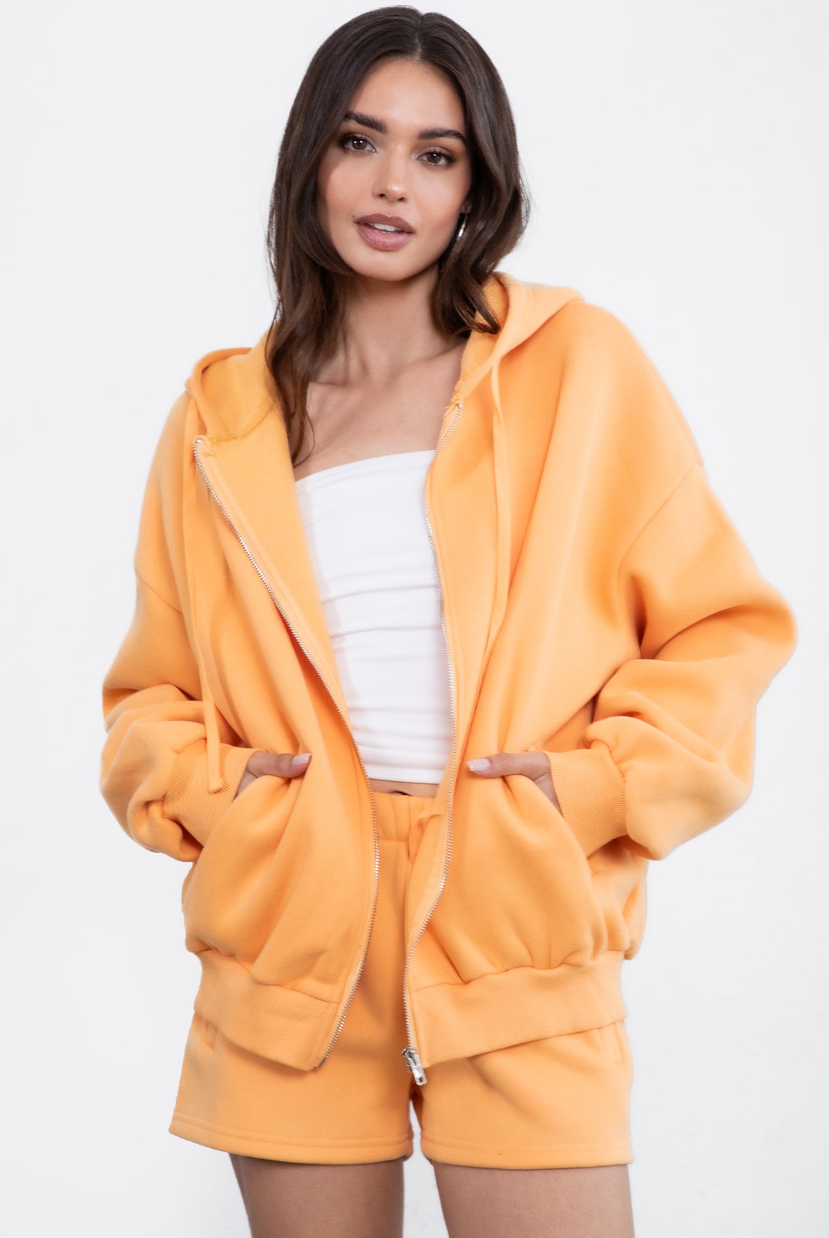 Orange zip-up fleece hoodie with a thick, warm fabric and relaxed fit, designed for casual comfort by Tic Toc.