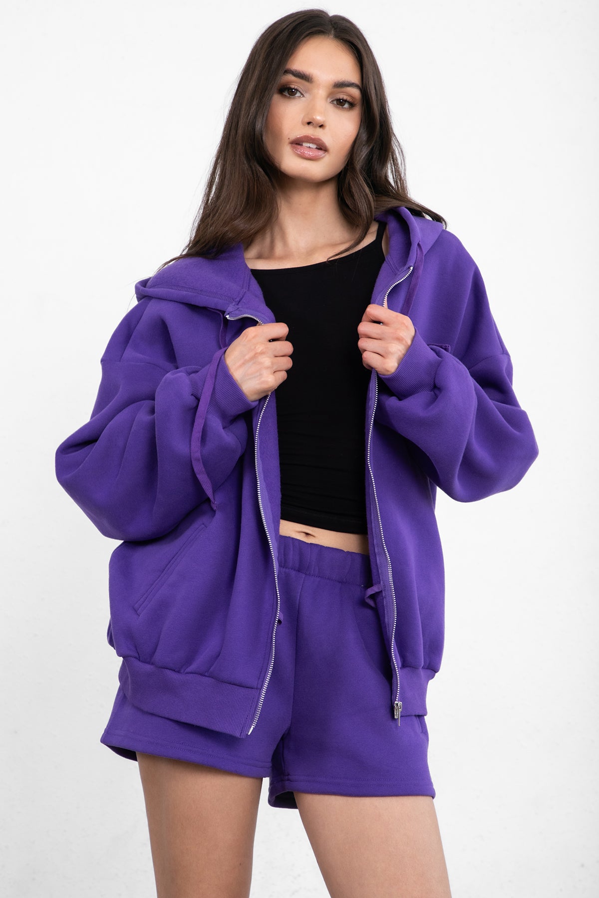 Purple oversized zip-up fleece hoodie with ribbed cuffs and a thick fleece texture for added warmth by Tic Toc.