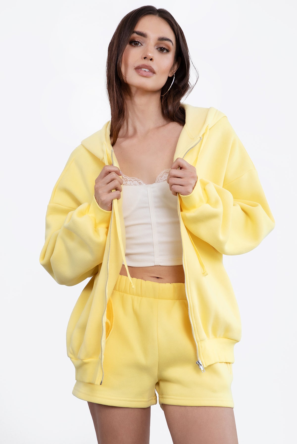 Yellow oversized zip-up fleece hoodie featuring a relaxed fit and adjustable drawstring hood by Tic Toc.