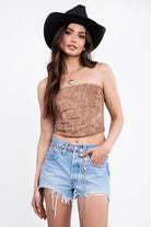 Woman wearing TIC TOC TA29069-BECKEE BECKEE embroidered western corset top featuring a strapless straight neckline, boned panel construction, dual lined PU vegan leather body, and rope lace-up detail at the center back, styled with high-waisted denim for a bold rodeo-ready western going-out look.