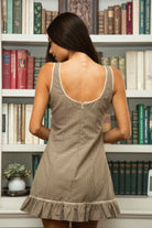 Woman wearing TIC TOC DA31931-AMELIE AMELIE gingham mini dress featuring a square scoop neckline with picot trim, wide shoulder straps, front faux button detail, fitted bodice with under bust seam, ruffled hem mini skirt in gingham poplin fabric, and a clean back zipper closure, styled with simple accessories for a coquette, western-sweet summer look.