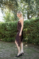 Woman wearing TIC TOC DA31971 LINORA satin lace contrast V-neck mini dress featuring a soft satin body, scalloped lace trim at the neckline, thin adjustable straps, asymmetrical lace-trim hem, and side slit detail for a sleek feminine night-out look.