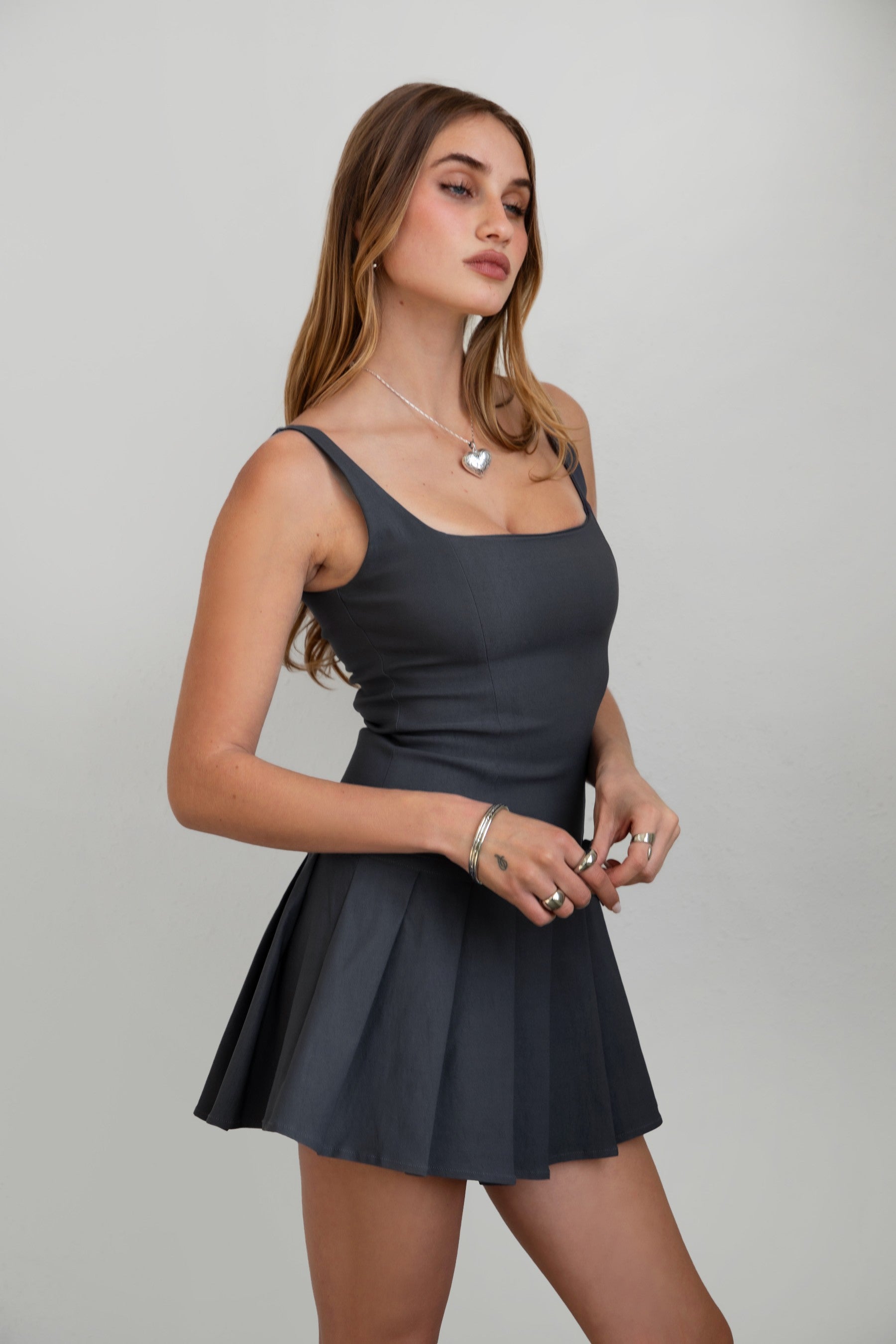 TIC TOC DC30797 ADRINA Charcoal Drop Waist Mini Dress with pleated skirt and bow detail.