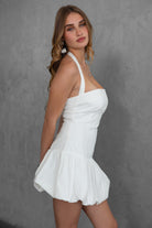 TIC TOC DH30936 DOLY Mini Dress featuring halter neckline, lace-up open back, and bubble hem in stretch twill fabric.