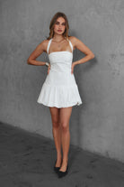 TIC TOC DH30936 DOLY Mini Dress featuring halter neckline, lace-up open back, and bubble hem in stretch twill fabric.