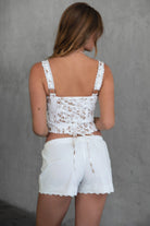DANIE Stretch Poplin Low Rise Shorts 
Adjustable Tie Stretch Waistband 
Button Placket At Center Front
Exposed Vertical Seaming
Exposed Lace Hem 
Summer Cotton Linen Like Airy Fabric 