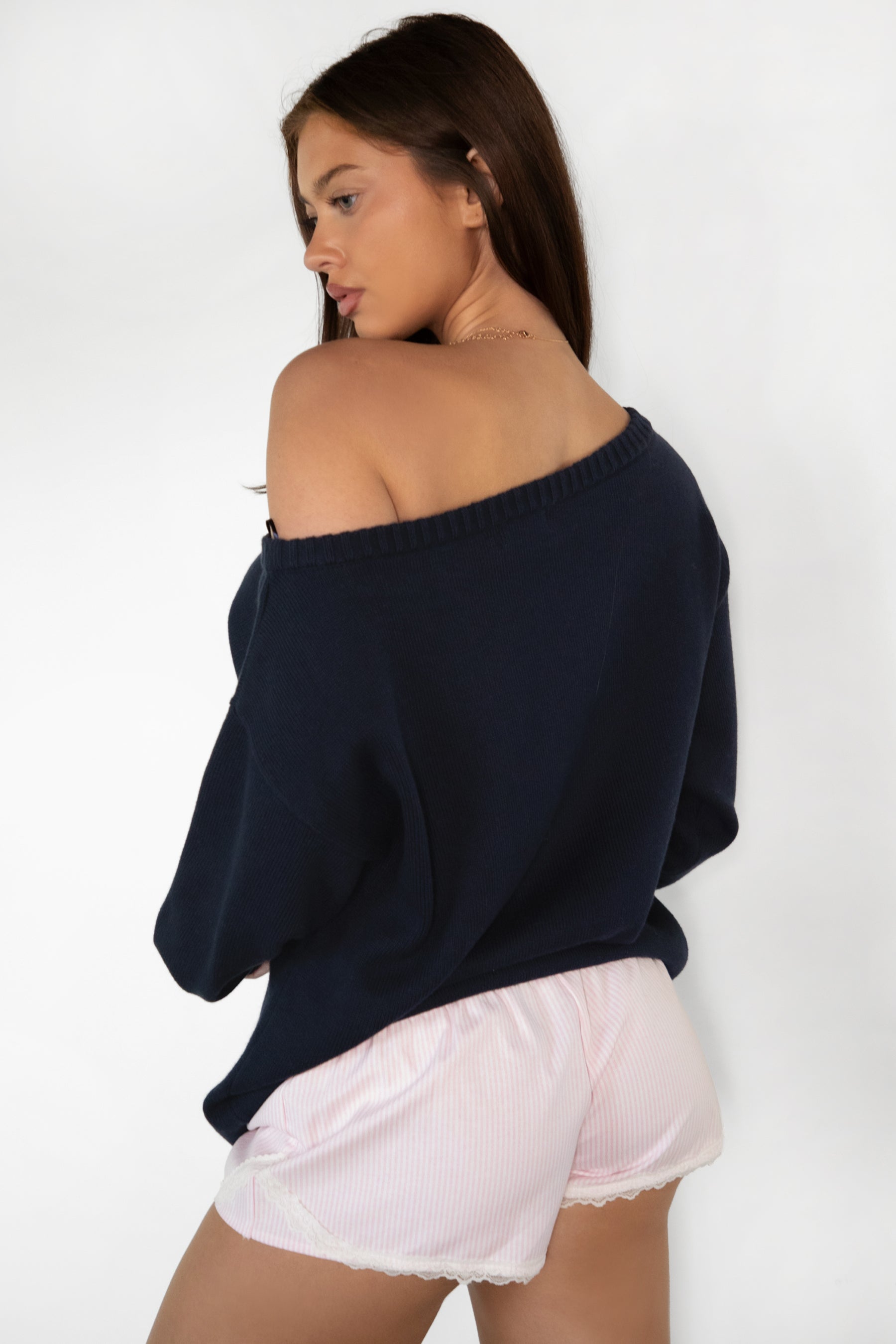 Woman wearing TIC TOC PC31878-BLUBELL BLUBELL low rise lace trim shorts in a soft blue vertical stripe pattern, featuring a stretch low rise waistband, faux button front detail, delicate lace hem and side lace accents, styled with a simple camisole for a cozy lounge and sleepwear look.