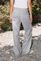 Woman wearing STETSON classic mid rise stripe wide leg denim pants featuring structured cotton stripe denim, classic mid rise waist, button and zip fly closure, subtle vertical stripe pattern, relaxed wide leg silhouette, full length fit, classic five pocket design, and belt loops for everyday western styling.