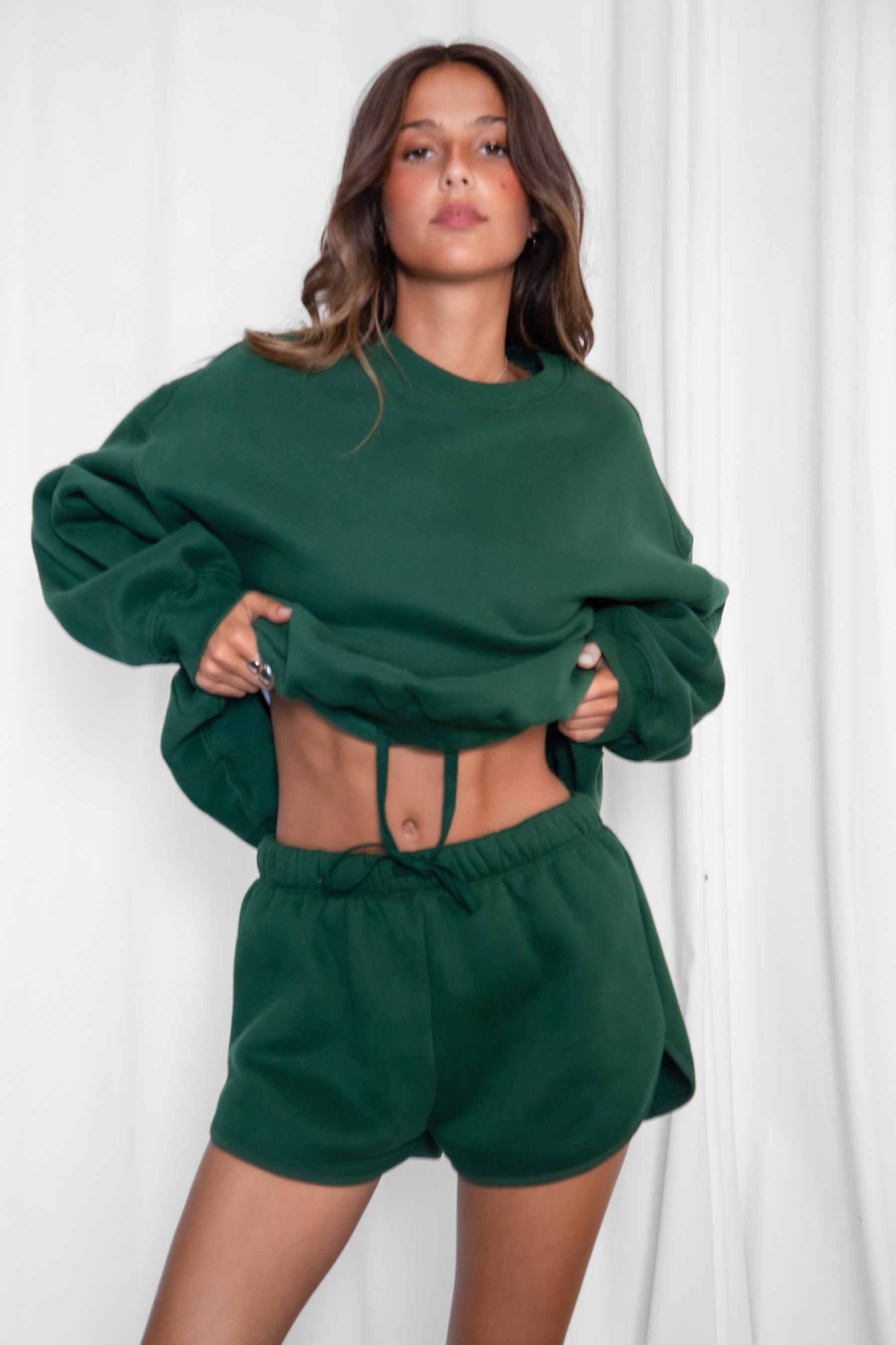 SHORTY  Solid Drawstring Waist Fleece Track Mini Short
 Mid Rise Waistband
Adjustable Waist Drawstring Tie
Retro Sporty Dolphin Curved Hemline
Straight Leg Fit Inseam 2.75 inches
SHORTY  Solid Drawstring Waist Fleece Track Mini Shorts
 Mid-Rise Waistband
Adjustable Waist Drawstring Tie
Retro Sporty Dolphin Curved Hemline
Inseam 2.75 inches
Matching Shades to the Essentials Plush Fleece Collection

Plush Fleece Key Features:
Plush & Fluffy Texture: Ultra-soft and incredibly cozy.
Heavyweight Warmth: Provides