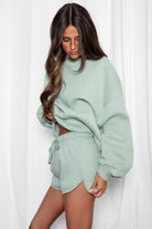 SHORTY  Solid Drawstring Waist Fleece Track Mini Short
 Mid Rise Waistband
Adjustable Waist Drawstring Tie
Retro Sporty Dolphin Curved Hemline
Straight Leg Fit Inseam 2.75 inches
SHORTY  Solid Drawstring Waist Fleece Track Mini Shorts
 Mid-Rise Waistband
Adjustable Waist Drawstring Tie
Retro Sporty Dolphin Curved Hemline
Inseam 2.75 inches
Matching Shades to the Essentials Plush Fleece Collection

Plush Fleece Key Features:
Plush & Fluffy Texture: Ultra-soft and incredibly cozy.
Heavyweight Warmth: Provides