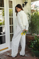 PH29607-CAMBRIDGE Mid Rise Linen Wide Leg Pants&nbsp; offer effortless elegance with a relaxed, tailored edge. Designed with a mid-rise fit, front clasp and zipper closure, belt loops, and both front and back pockets, these pants feature subtle pleats and a floor-grazing wide leg for a flattering, flowy silhouette. Crafted from a breathable, lightweight linen blend—perfect for lounging, travel, or a breezy boho-inspired look.

Pairs perfectly with matching tops (sold separately: TH29605, TH29609).
