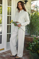 PH29607-CAMBRIDGE Mid Rise Linen Wide Leg Pants&nbsp; offer effortless elegance with a relaxed, tailored edge. Designed with a mid-rise fit, front clasp and zipper closure, belt loops, and both front and back pockets, these pants feature subtle pleats and a floor-grazing wide leg for a flattering, flowy silhouette. Crafted from a breathable, lightweight linen blend—perfect for lounging, travel, or a breezy boho-inspired look.

Pairs perfectly with matching tops (sold separately: TH29605, TH29609).