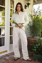 PH29607-CAMBRIDGE Mid Rise Linen Wide Leg Pants&nbsp; offer effortless elegance with a relaxed, tailored edge. Designed with a mid-rise fit, front clasp and zipper closure, belt loops, and both front and back pockets, these pants feature subtle pleats and a floor-grazing wide leg for a flattering, flowy silhouette. Crafted from a breathable, lightweight linen blend—perfect for lounging, travel, or a breezy boho-inspired look.

Pairs perfectly with matching tops (sold separately: TH29605, TH29609).
