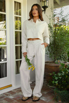 PH29607-CAMBRIDGE Mid Rise Linen Wide Leg Pants&nbsp; offer effortless elegance with a relaxed, tailored edge. Designed with a mid-rise fit, front clasp and zipper closure, belt loops, and both front and back pockets, these pants feature subtle pleats and a floor-grazing wide leg for a flattering, flowy silhouette. Crafted from a breathable, lightweight linen blend—perfect for lounging, travel, or a breezy boho-inspired look.

Pairs perfectly with matching tops (sold separately: TH29605, TH29609).